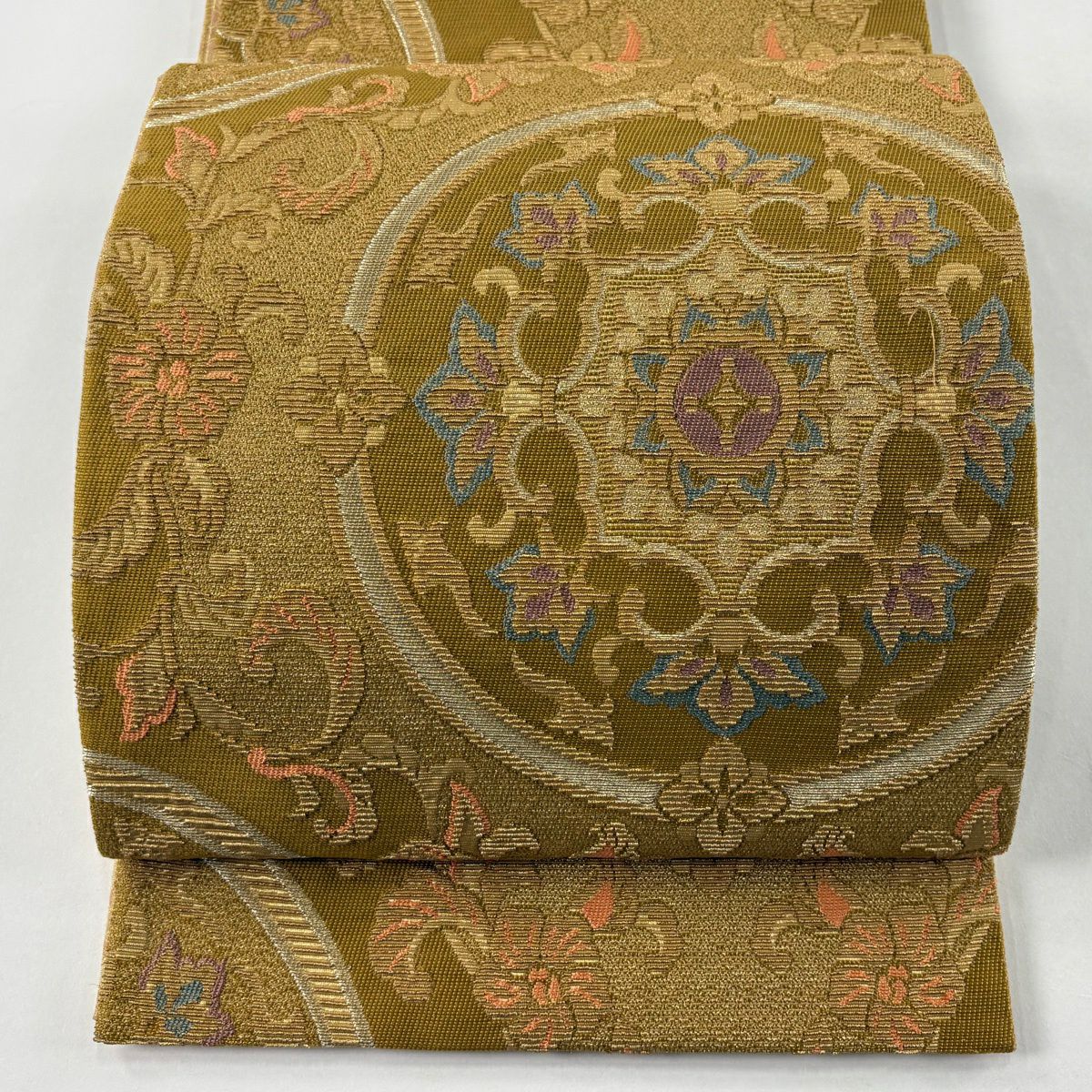 美品】 袋帯 逸品 華文 花唐草 金糸 綴れ 薄小豆 お太鼓柄 正絹｜中古