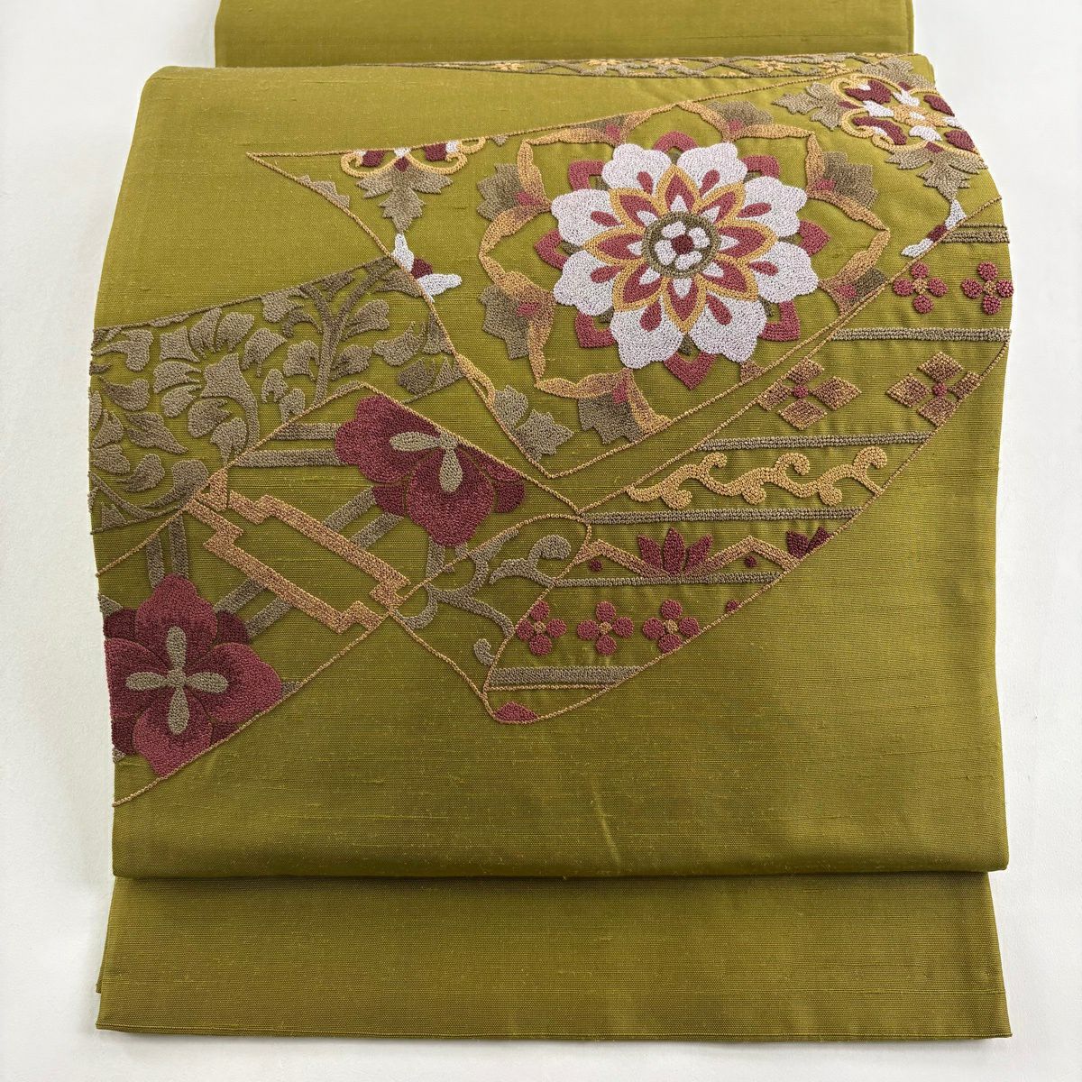 袋帯 秀品 花唐草 相良刺繍 金通し オレンジ お太鼓柄 正絹｜中古