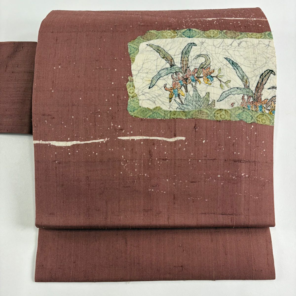袋帯 　正絹　手彫木版染め 名古屋帯 名品 落款あり 手彫木版染 紬地 草花 七宝 小豆色 正絹