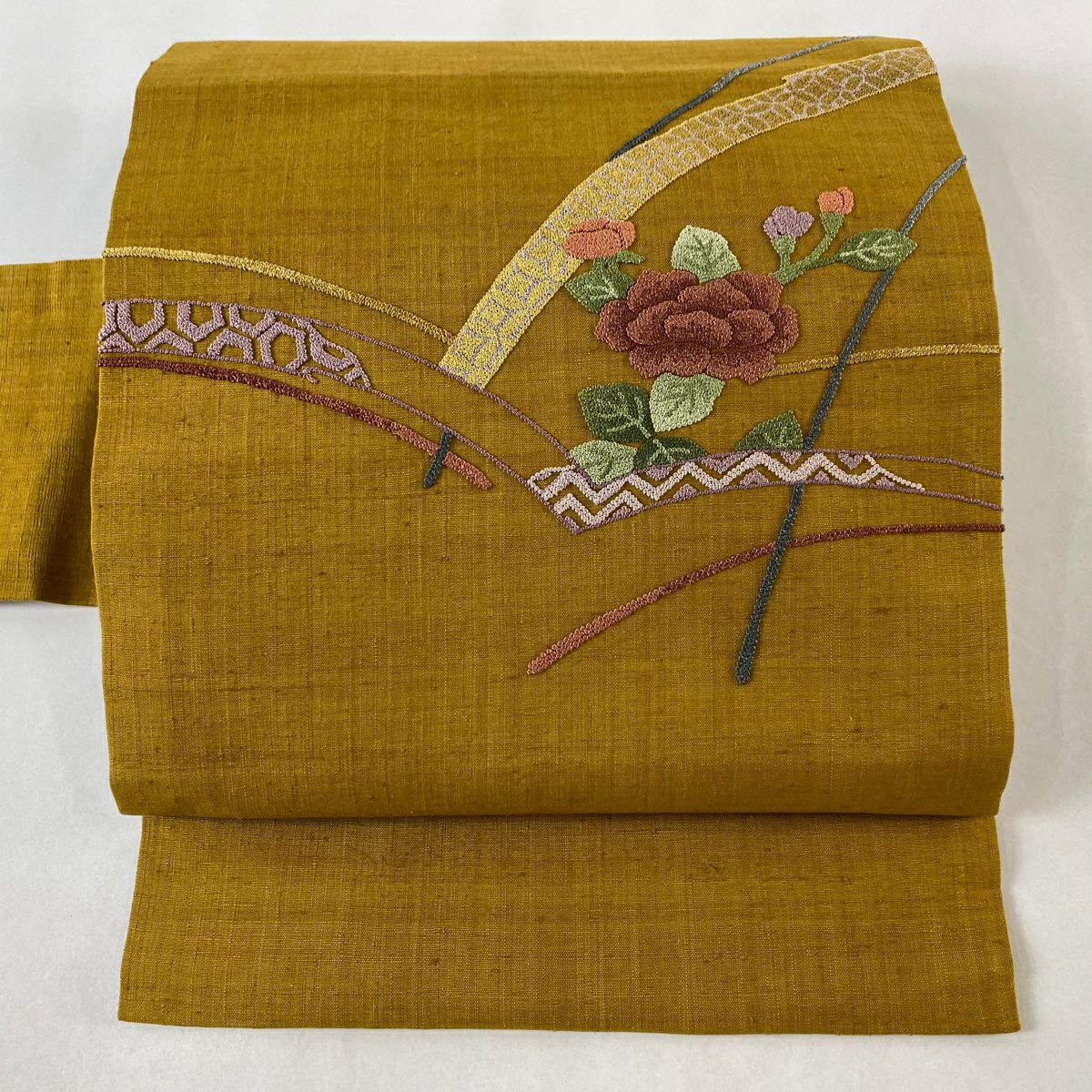 名古屋帯 美品 秀品 紬地 草花 霞 刺繍 薄ピンク 正絹｜中古