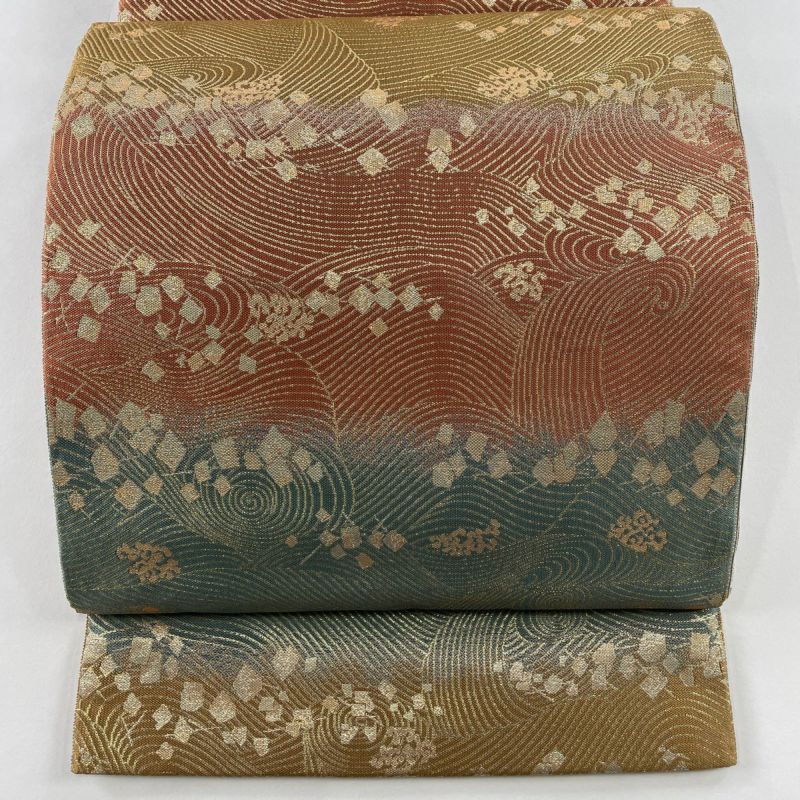 ファッションなデザイン 袋帯 美品 正絹｜中古 全通 薄オレンジ 箔 箔ちらし 波 秀品 水着・ラッシュガード