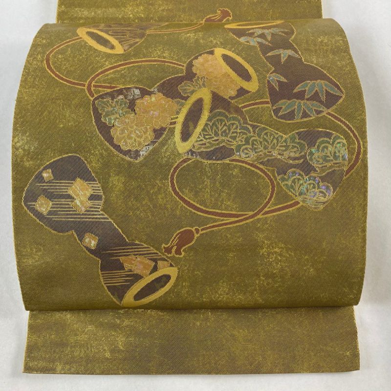 袋帯 美品 逸品 引箔本金紹巴 菱重ね鏡文 金糸 金色 お太鼓柄