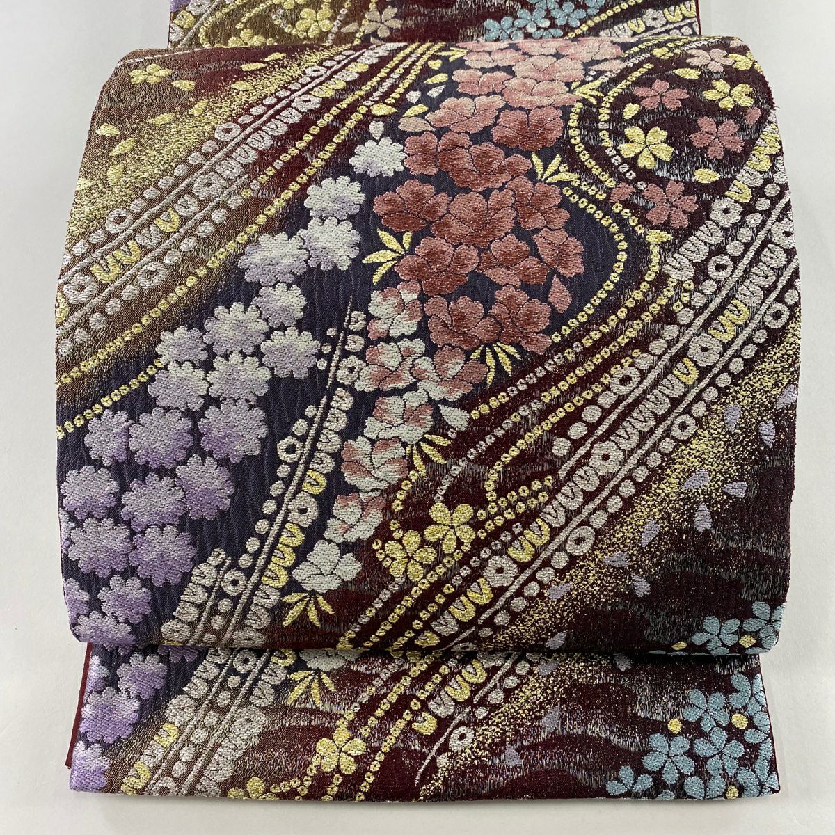 袋帯 美品 名品 華文 草花 箔 ラメ糸 銀色 六通 正絹｜中古