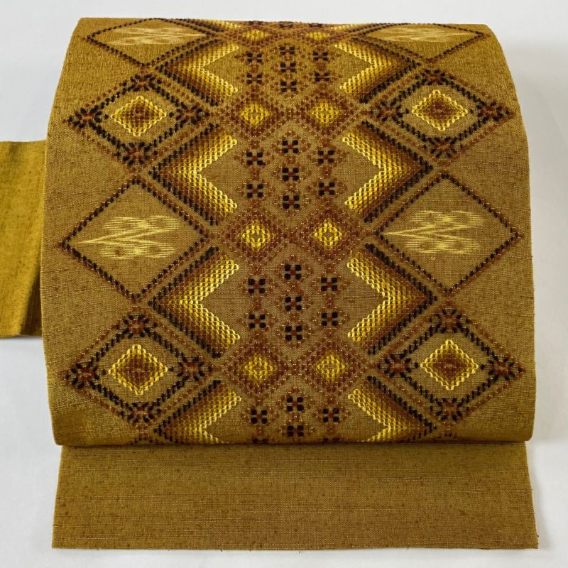 名古屋帯 美品 逸品 紬地 菱 幾何学模様 山吹茶色 正絹｜中古