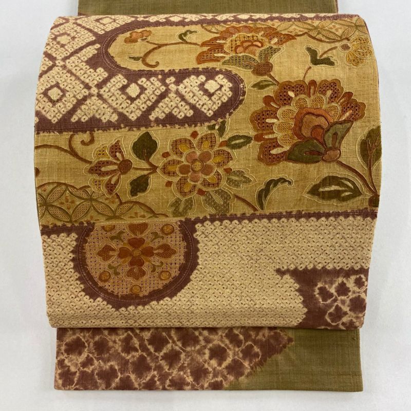 袋帯 美品 秀品 紬地 花唐草 ヱ霞 絞り 刺繍 小豆色 お太鼓柄